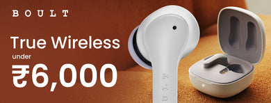 earbuds under 6000 with sleek designs in black and gray charging cases, placed on a fabric surface.